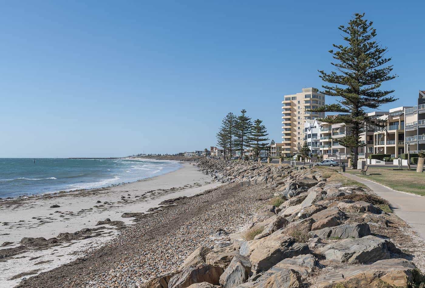 Glenelg North beach in Adelaide with sand, rocks and a coastal path